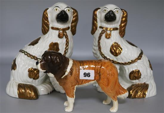 A pair of Staffordshire spaniels, and a Beswick Corna Garth Stroller